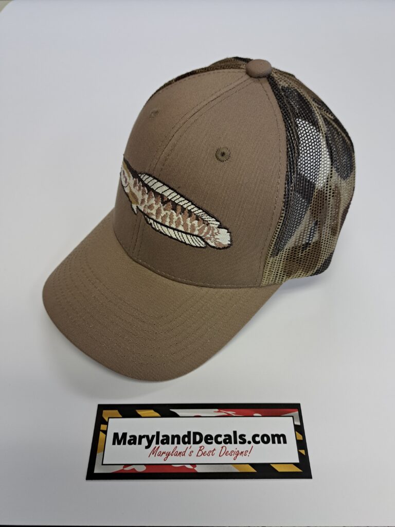 A Khaki Color Hat With a Fish Embroidery Side